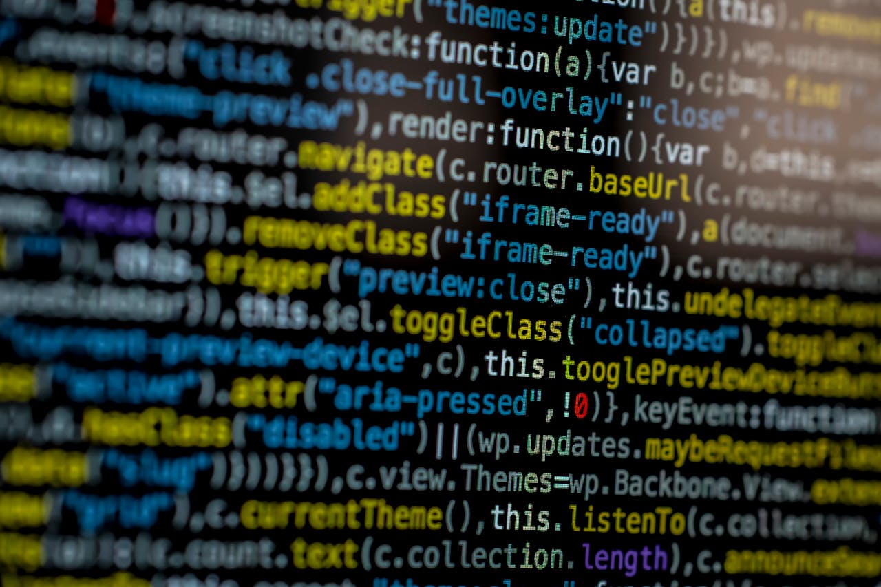 home-hero An extreme close-up of colorful programming code on a computer screen, showcasing development and software debugging.