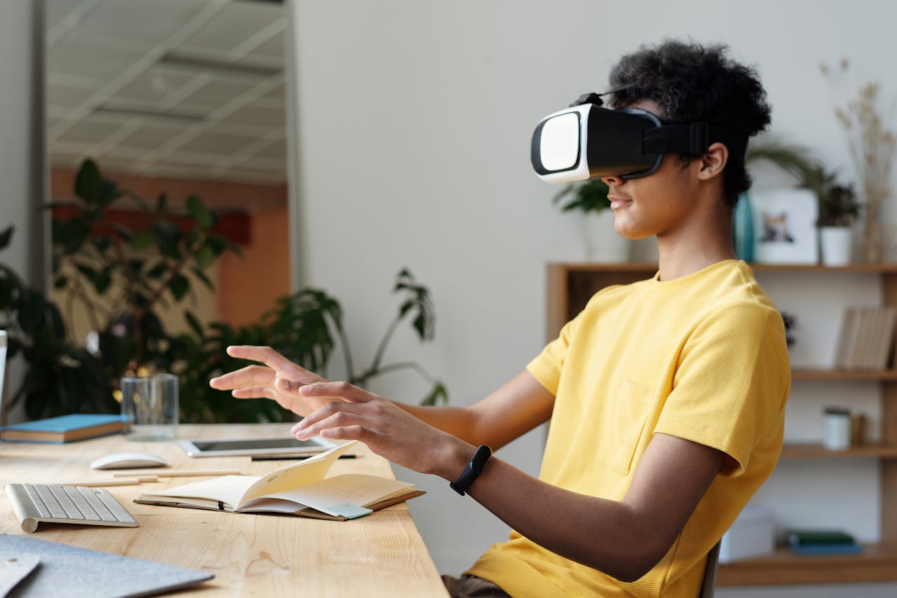 our-story Teenager wearing a VR headset and interacting in a home setting, enjoying virtual reality experience.